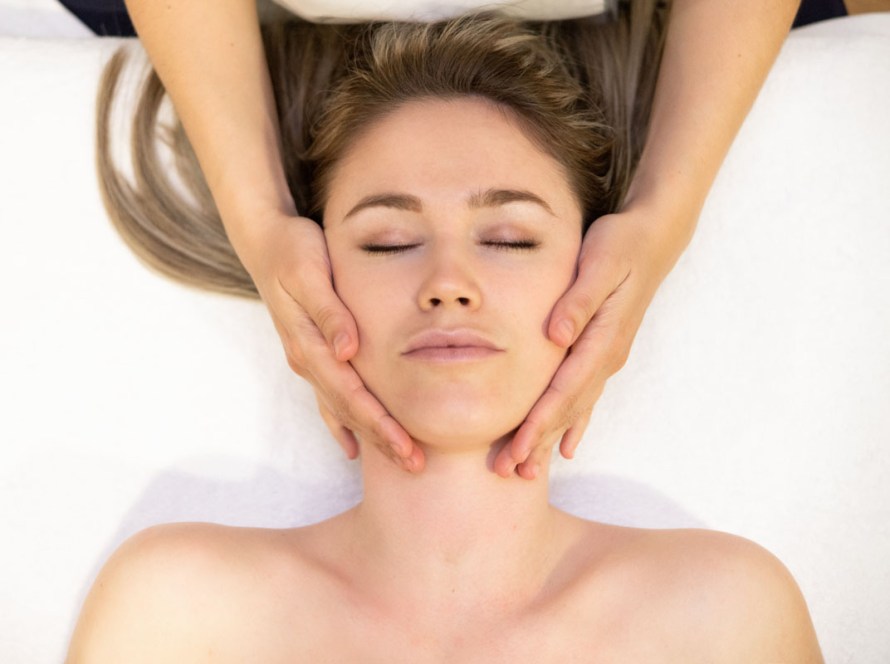pregnant woman receiving a relaxing prenatal massage at our wellness center in Pacific Beach, San Diego